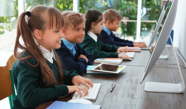 Children using Dreambox Reading plus on computers