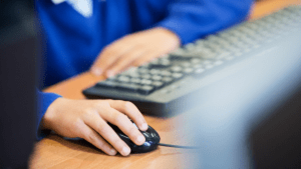 Pupil using a computer mouse