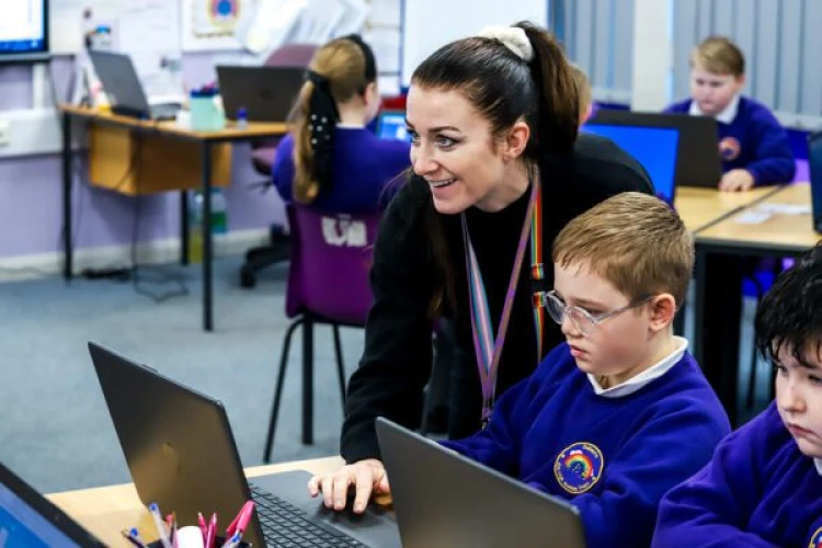 Teacher helping student on DreamBox Maths