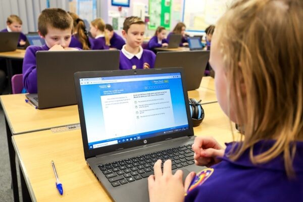 Child using Reading Plus on a laptop