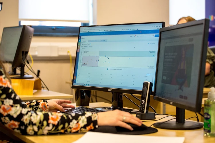 Person using a computer at a desk