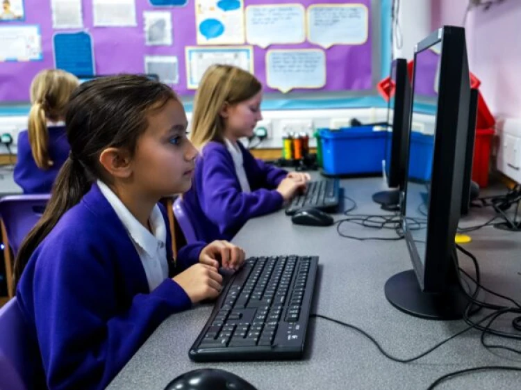 Schoolgirl looking at computer screen