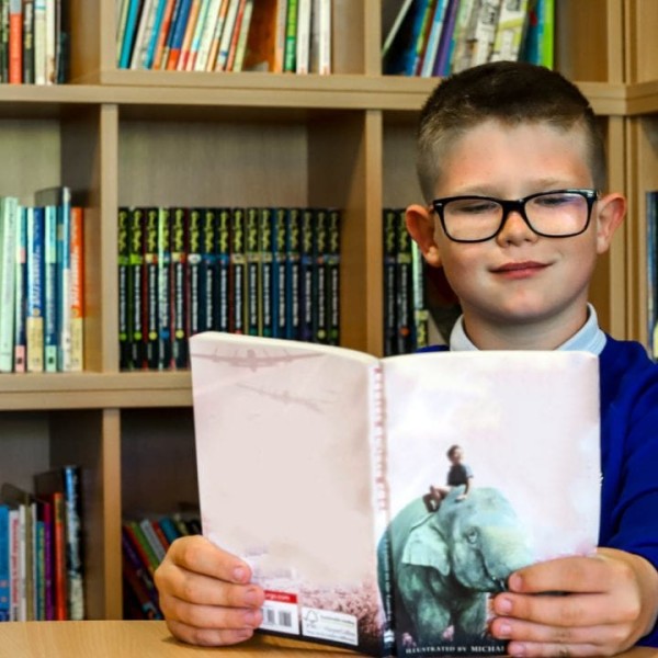 Pupil reading a book