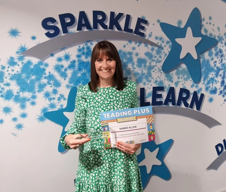 Teacher celebrating award