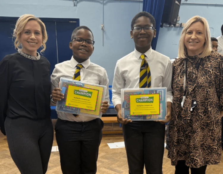 Children and teacher celebrating