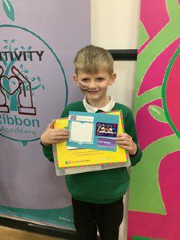 Jack holding his certificate