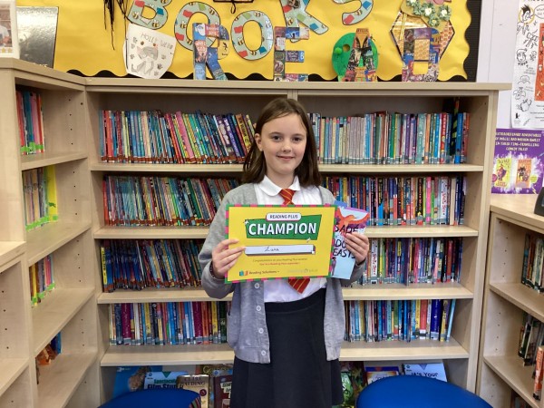 Luna holding her certificate