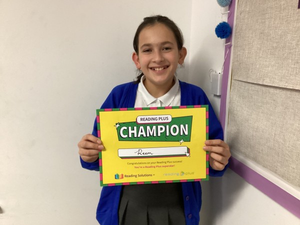 Reem holding a certificate