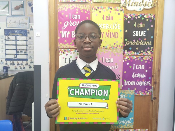 Nathaniel holding a certificate