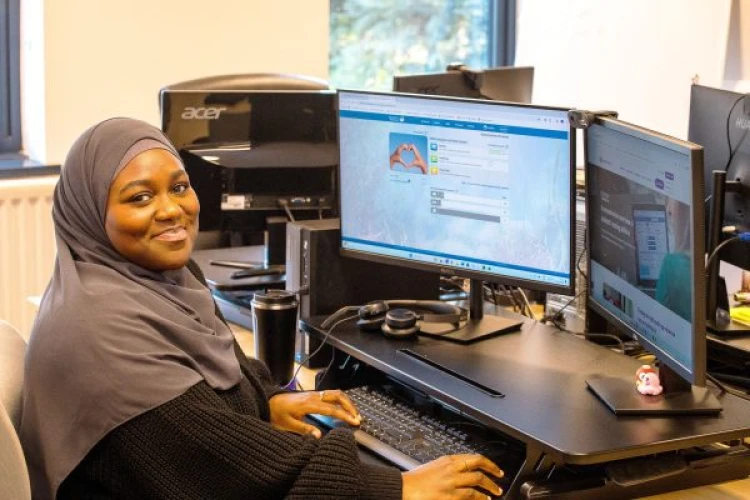 Customer Support Member at desk